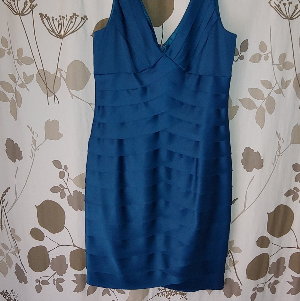 Jones wear teal layered formal dress